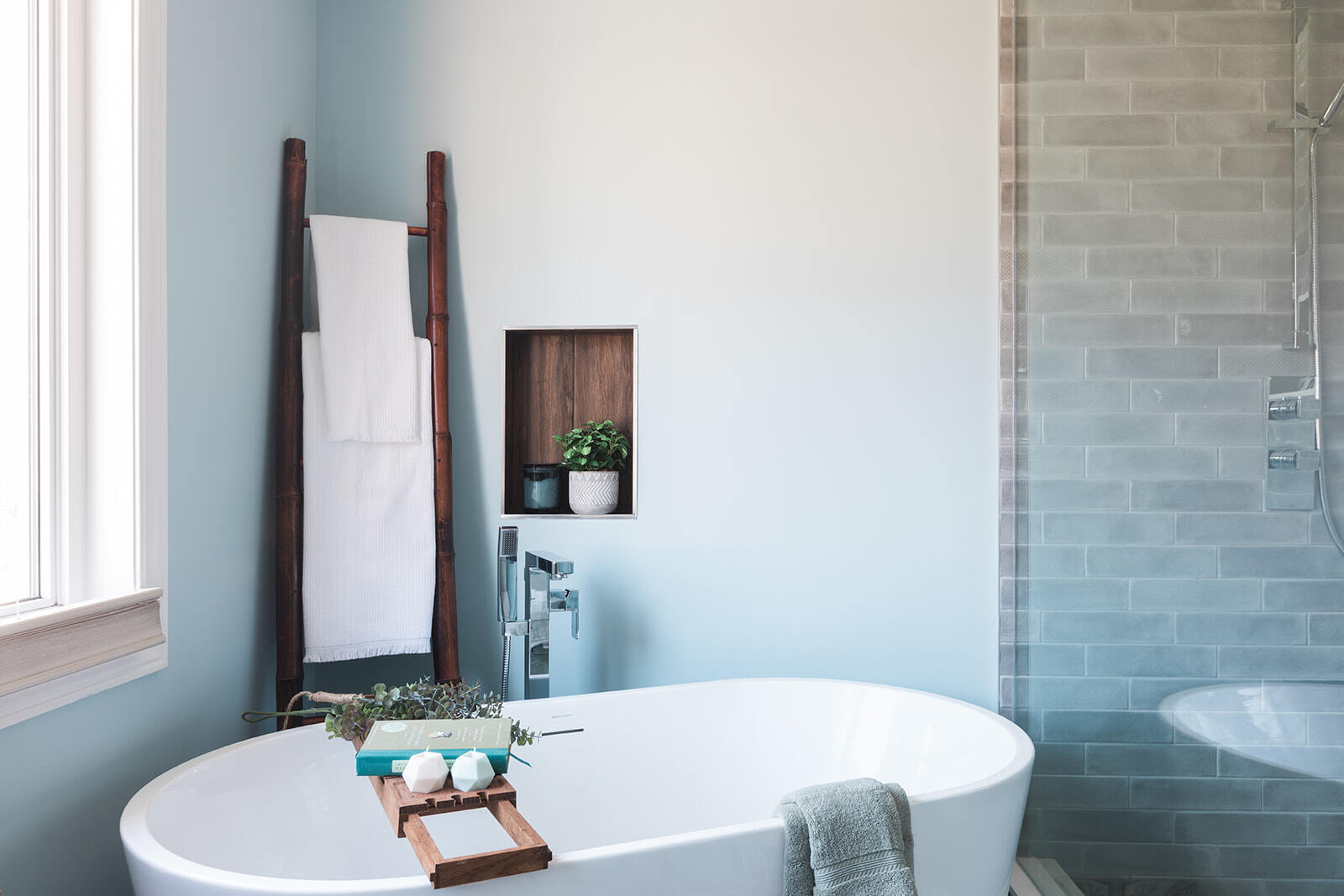 Elegant bathroom with a bathtub and shower, highlighting renovation materials from Golden Bee Homes.