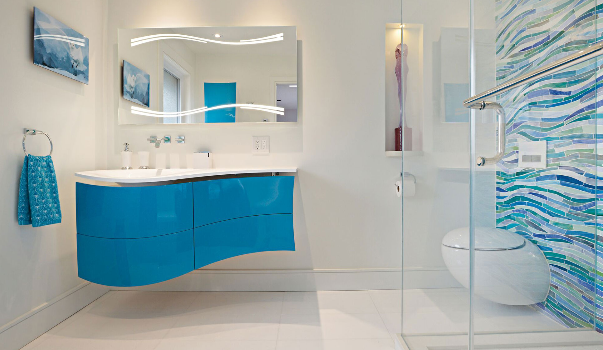A bathroom featuring a blue and white sink with a matching mirror, designed by Golden Bee Homes.