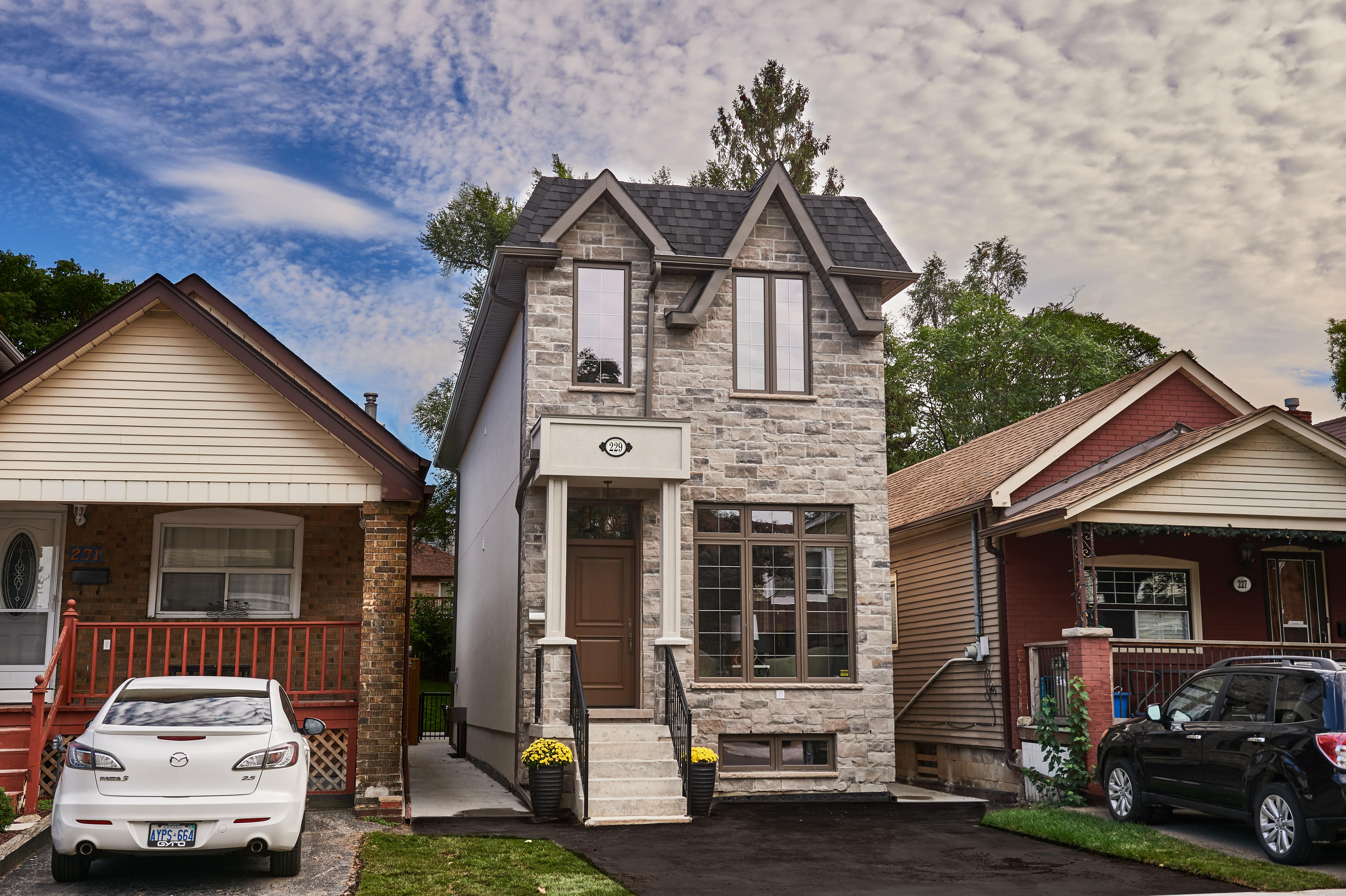 Custom built home; brick exterior, unique exterior designs; built by Golden Bee Homes.